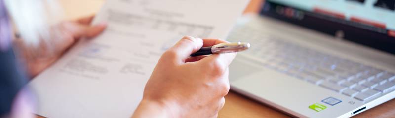 person-holding-pen-and-paper-2646033.jpg