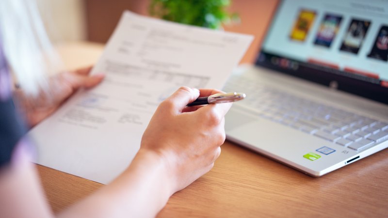 person-holding-pen-and-paper-2646033.jpg