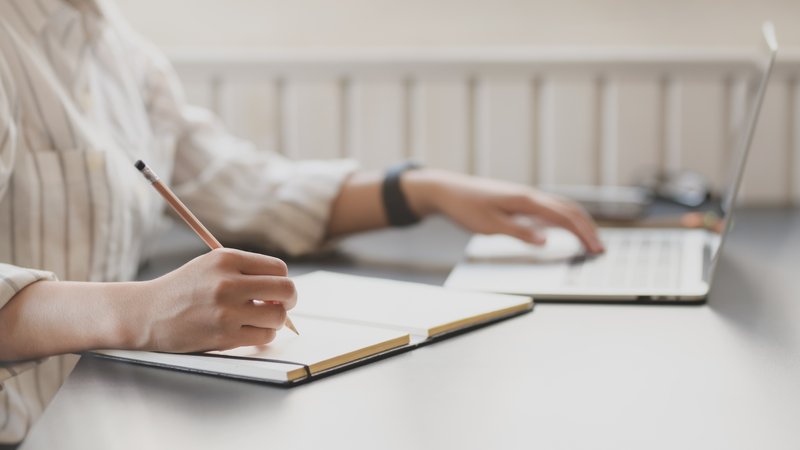 photo-of-person-writing-on-notebook-3758898.jpg